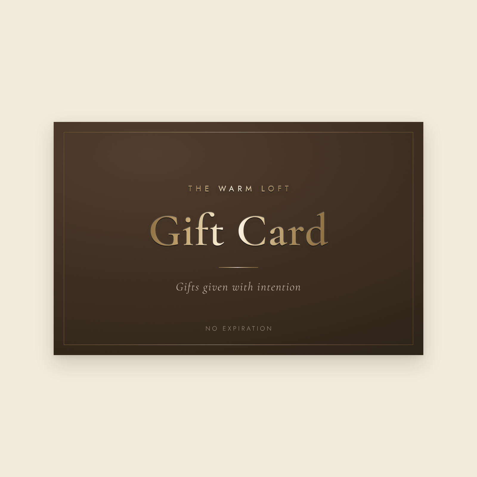 The Warm Loft gift card, champagne gold on espresso